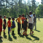 Brandon Jacobs with the kids at Football camp