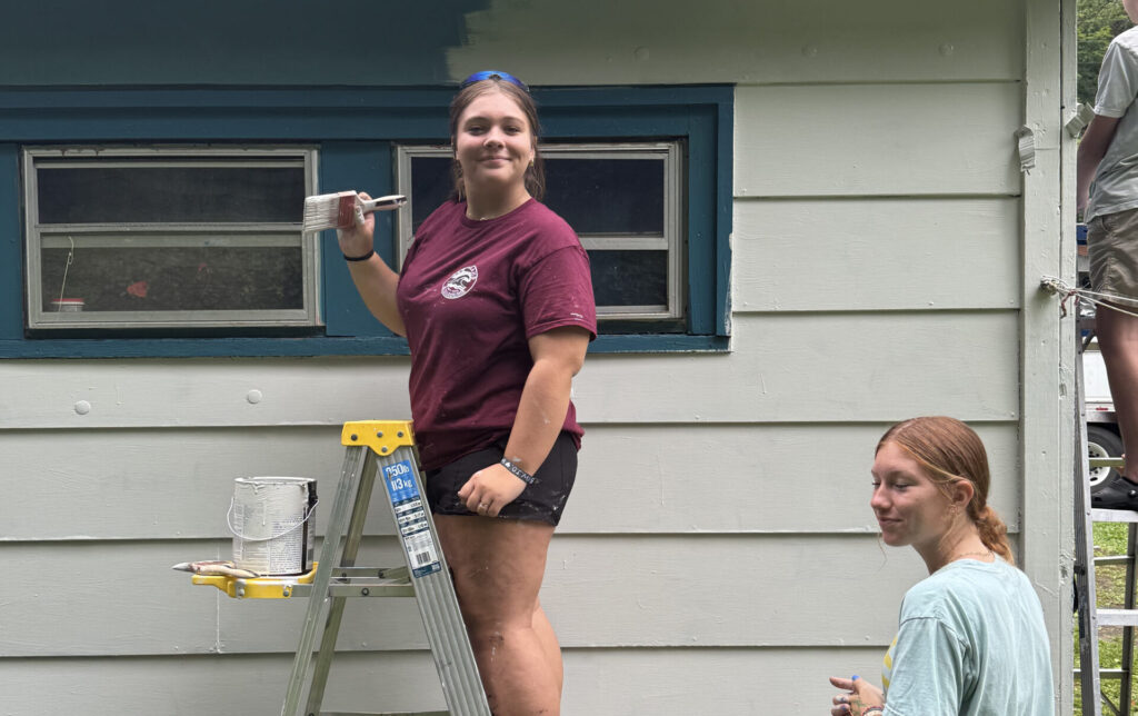 Mission Trip Girl on a ladder