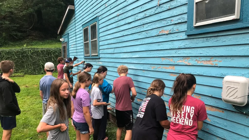 Youth Mission Trip painting a house